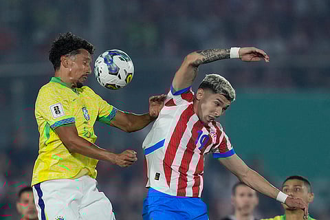 2026 FIFA World Cup Qualifying, Brazil vs Paraguay: Brazil's Marquinhos, left, and Paraguay's Julio Enciso go for a header